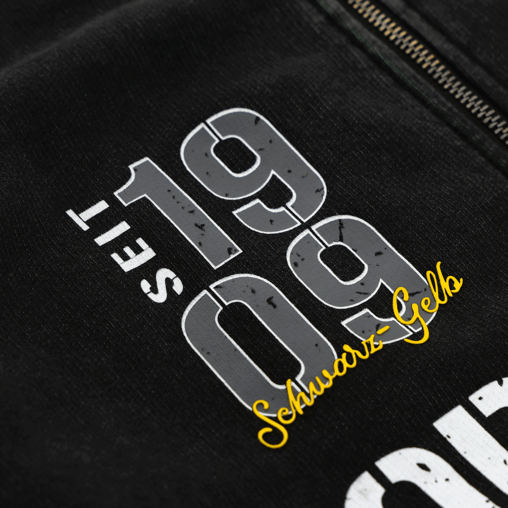Veste zippée BVB-Elements 2025, noire, ornée d'une inscription jaune « Schwarz-Gelb » très voyante et du motif « Seit 1909 », idéale pour les supporters du Borussia Dortmund.