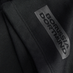Close-up of the BVB Essentials sweat shorts in black with Borussia Dortmund lettering, ideal for fans and sports enthusiasts.