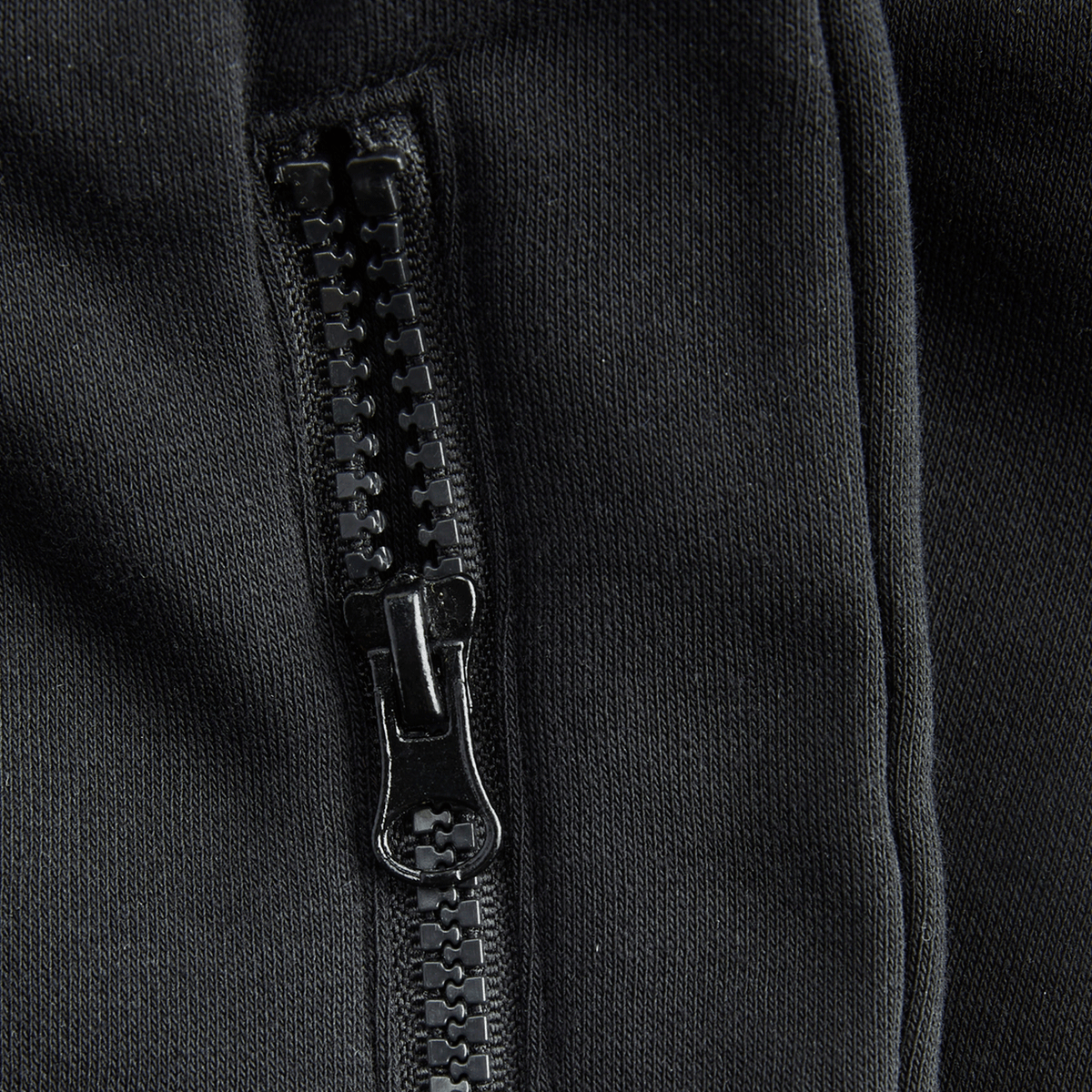 Close-up of black BVB Essentials zip-up sweat shorts.