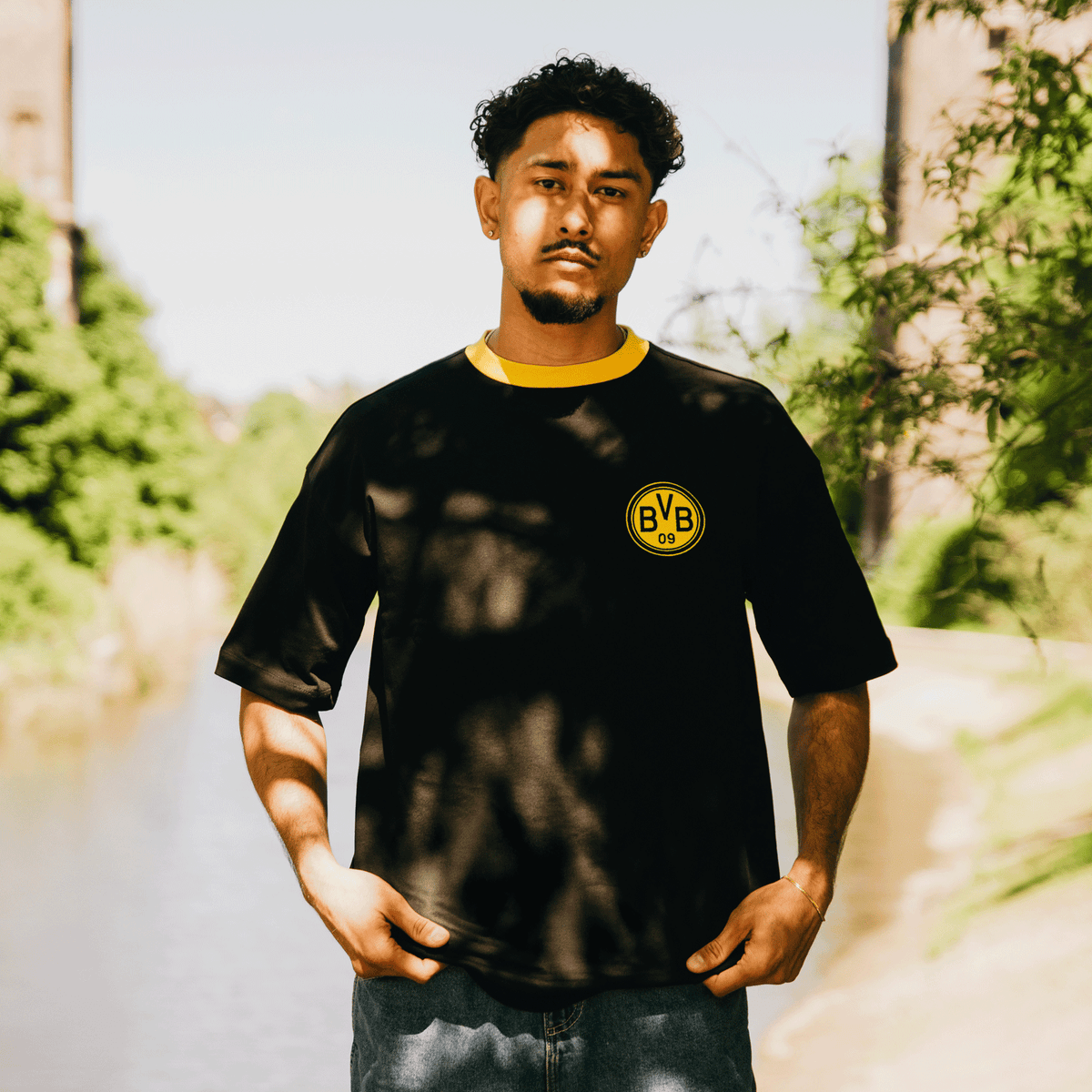 The black BVB Iconic Lifestyle T-shirt with a yellow collar and a prominent BVB logo on the chest—perfect for fans and casual wear.