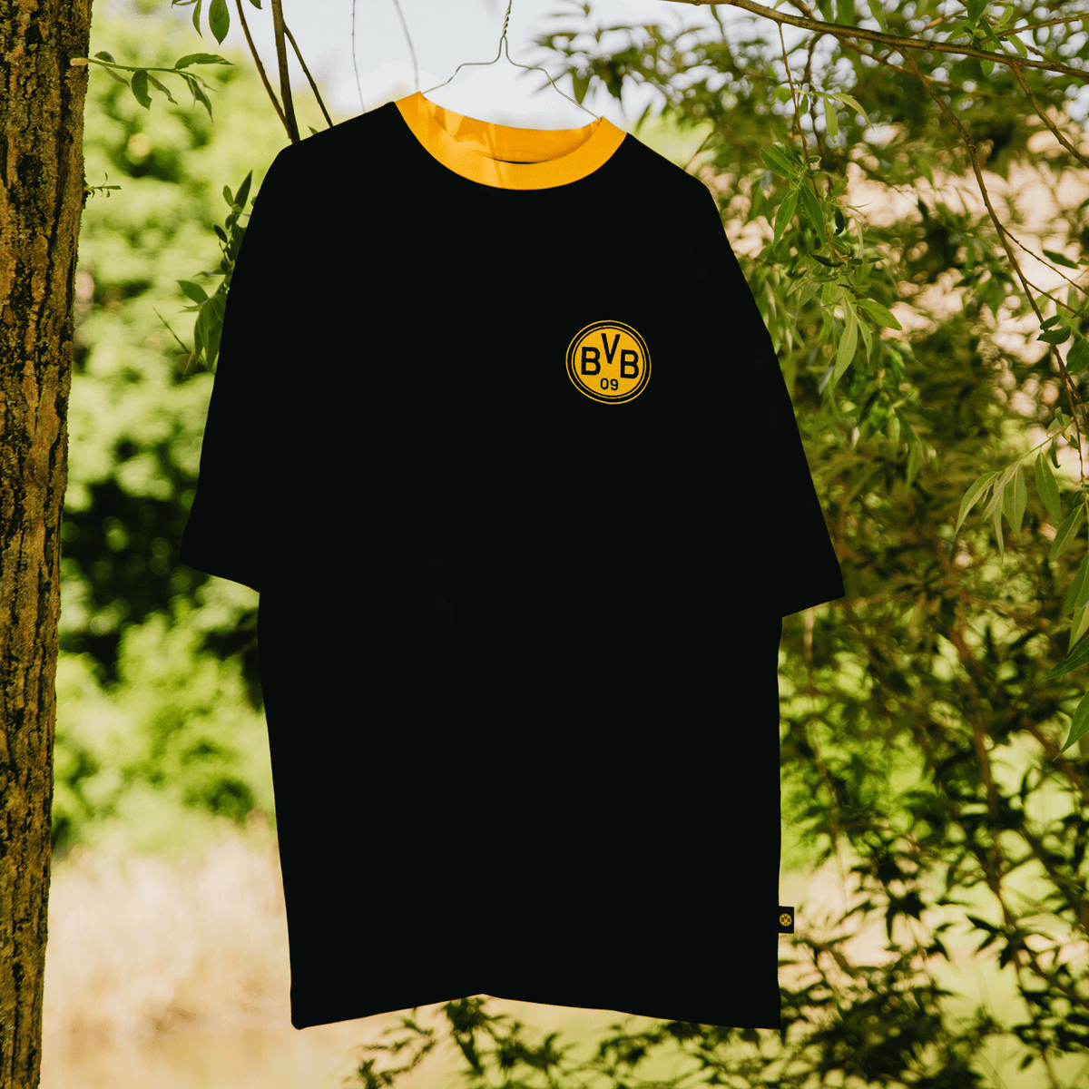 Black BVB Iconic Lifestyle T-shirt with a yellow collar and the BVB-09 logo on the chest, for Borussia Dortmund fans.