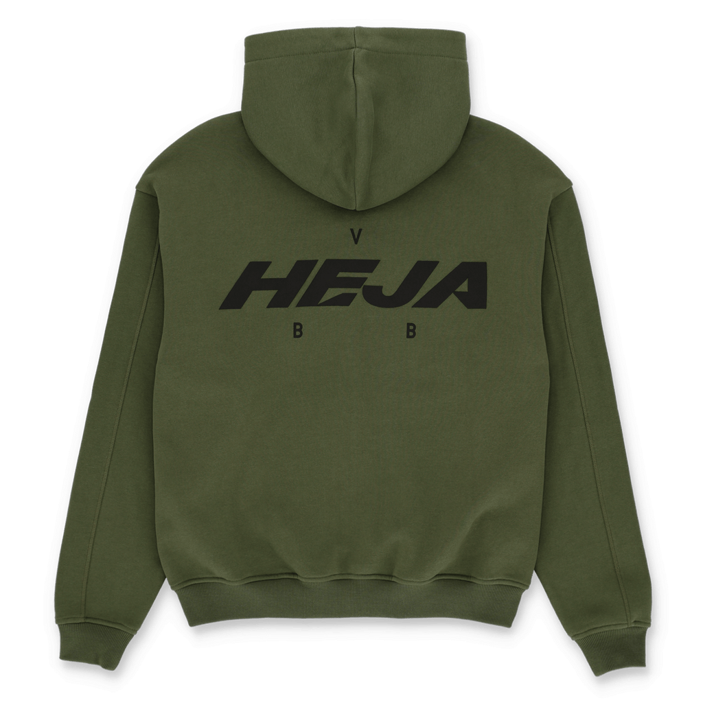 Green BVB Urban zip-up jacket, back view, with large black "HEJA BVB" lettering. Ideal as a fan item for Borussia Dortmund supporters.