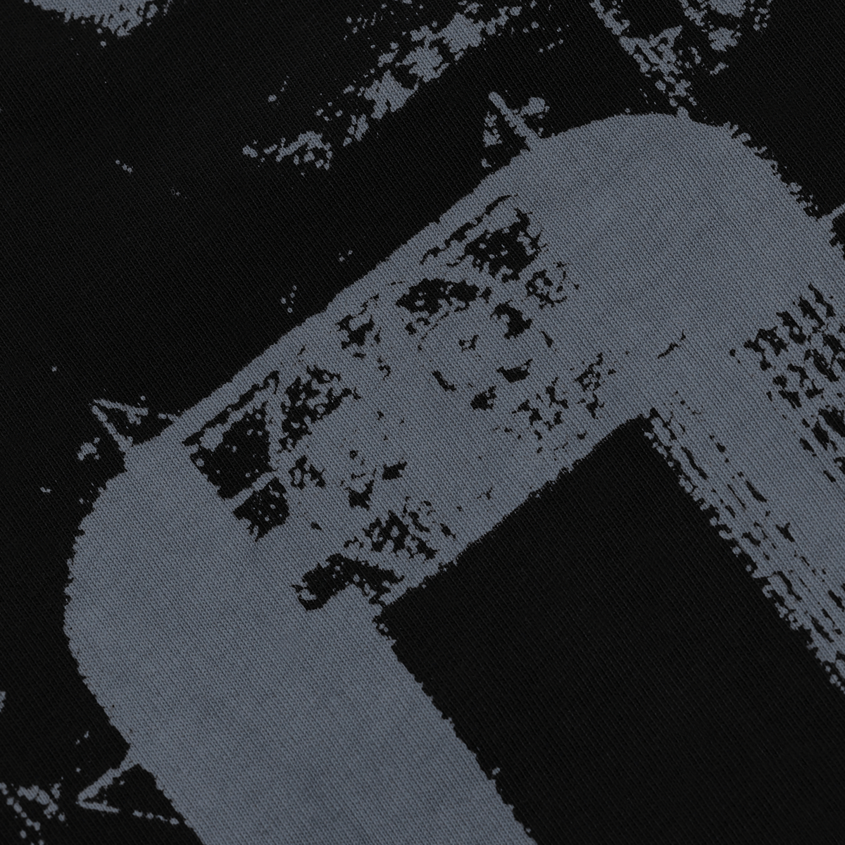Close-up view of a black-and-gray BVB long-sleeve shirt with a graphic pattern, available as fan merchandise.