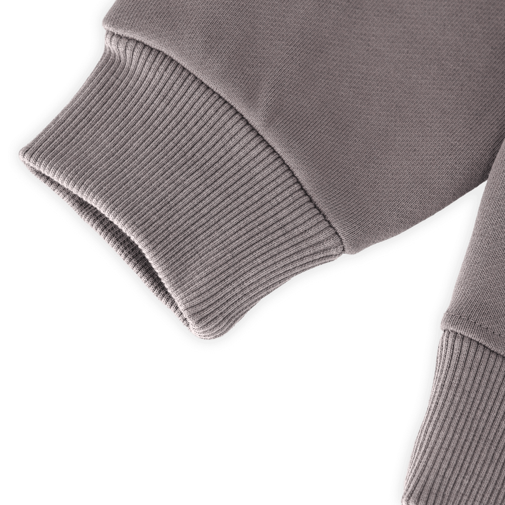Close-up of the gray BVB gaming hoodie for kids, showing the sleeve cuff. Official Borussia Dortmund fan merchandise.