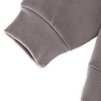 Close-up of the gray BVB gaming hoodie for kids, showing the sleeve cuff. Official Borussia Dortmund fan merchandise.