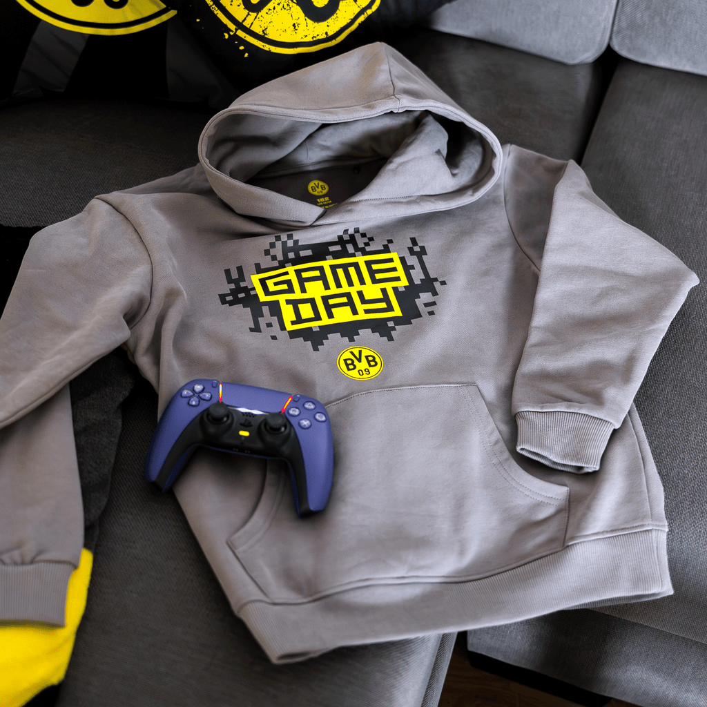 Gray BVB gaming hoodie for kids with eye-catching yellow "Game Day" lettering and the BVB 09 logo, perfect for young Borussia Dortmund fans and gaming enthusiasts.