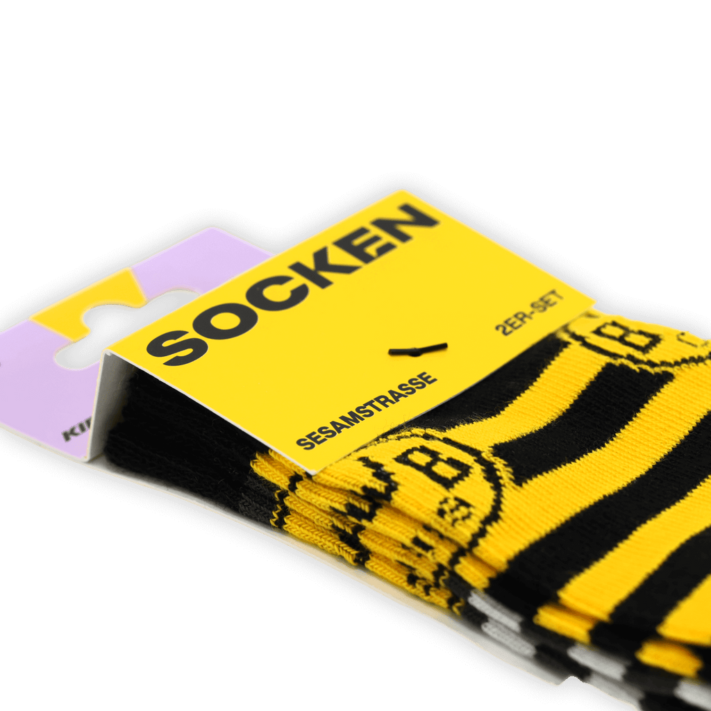 Juego de calcetines infantiles del BVB con motivos de Barrio Sésamo, en negro y amarillo, con rayas y el logotipo del BVB, ideal para los pequeños aficionados.
