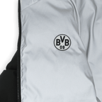 Veste réversible réfléchissante du BVB, avec un côté noir et un côté gris, ainsi qu’un logo BVB bien visible.
