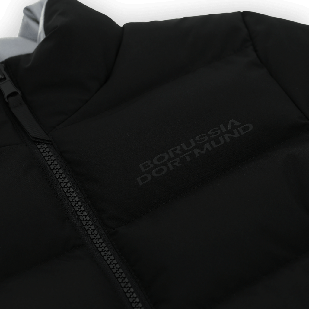 Black BVB reversible jacket for kids with reflective Borussia Dortmund lettering and a zipper—perfect for fans.