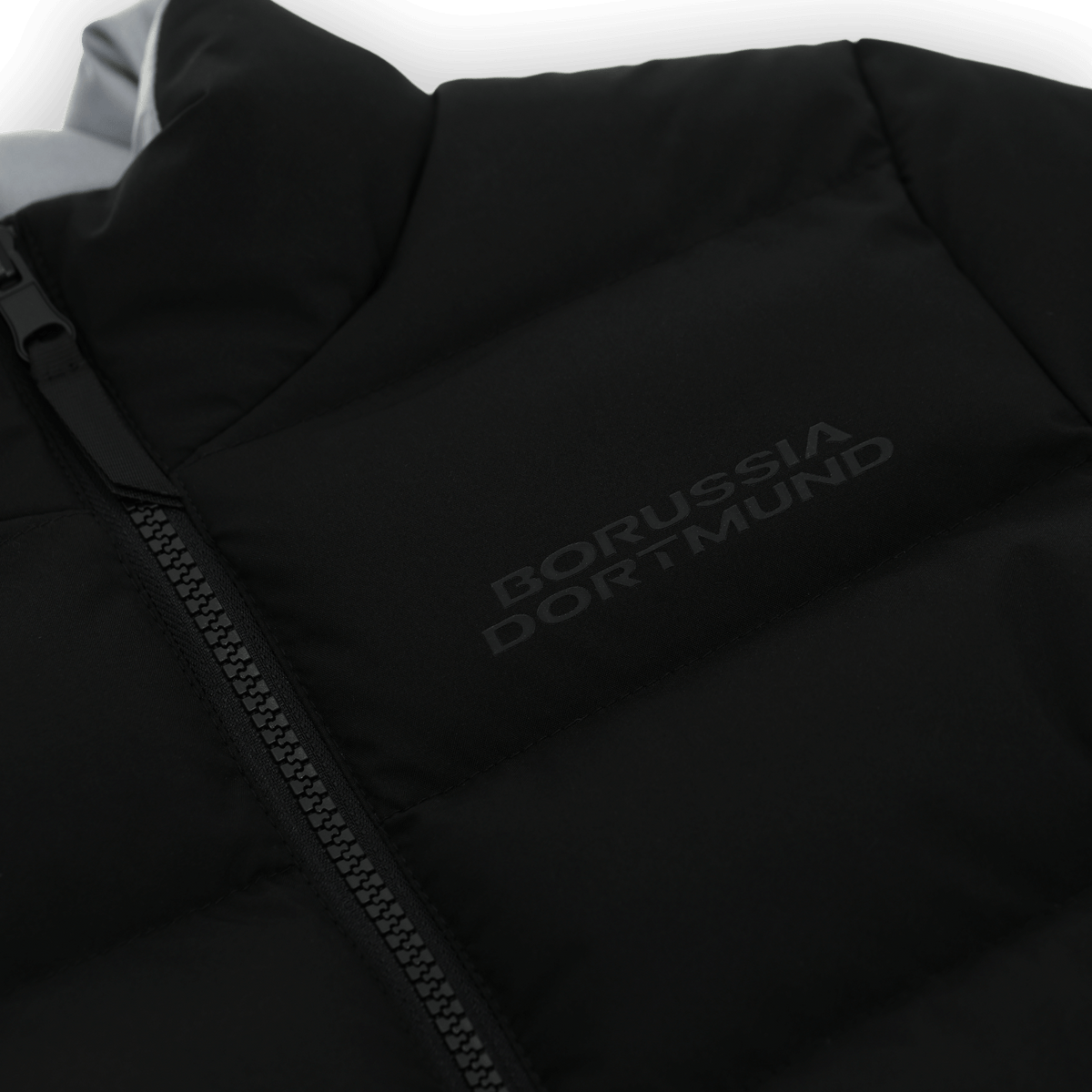 Black BVB reversible jacket for kids with reflective Borussia Dortmund lettering and a zipper—perfect for fans.