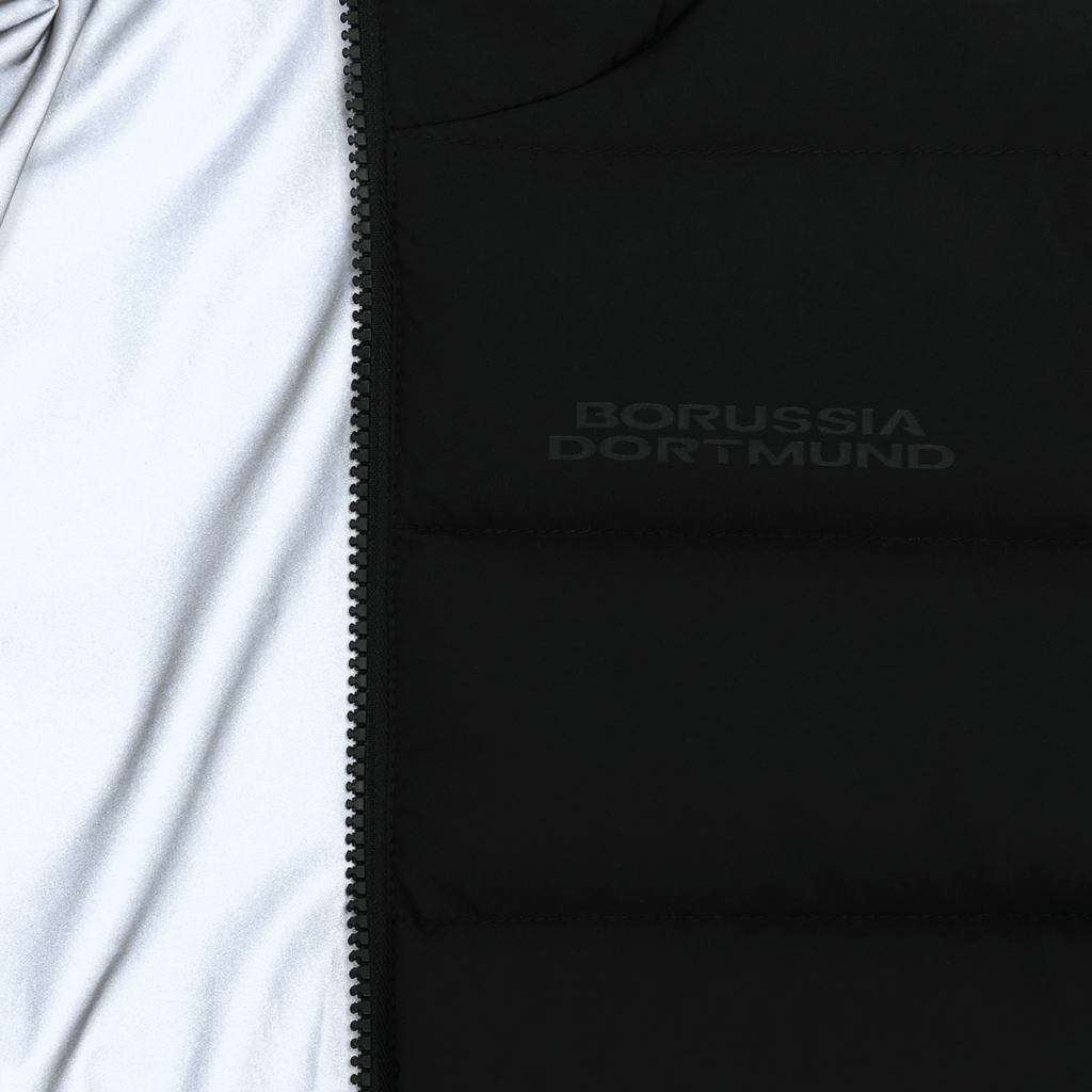 Black BVB reversible jacket for kids with reflective material and the Borussia Dortmund logo—perfect for fans.