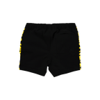 Vue arrière d'un maillot de bain BVB noir et jaune pour enfants, avec un motif à rayures jaunes très voyant sur les côtés et une poche arrière.