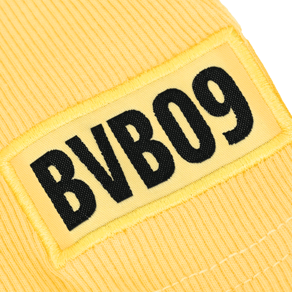 T-shirt jaune pour femme du Borussia Dortmund avec un écusson « BVB09 », idéal pour les fans.