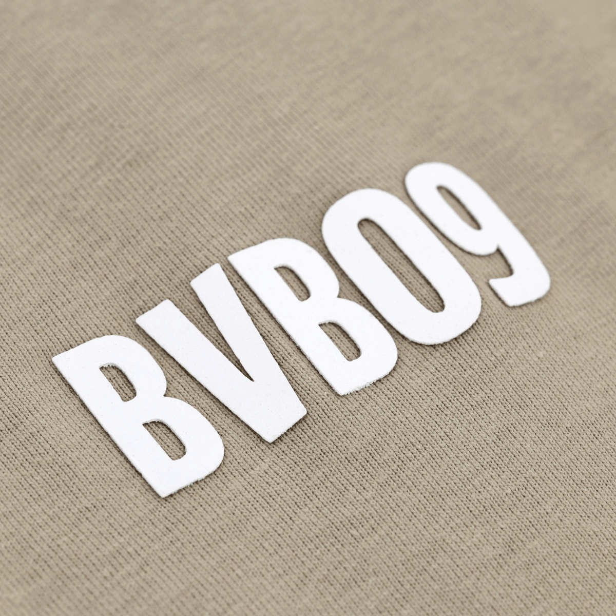 Close-up of a sage-green BVB T-shirt featuring prominent "BVB 09" lettering in white—perfect for BVB fans.