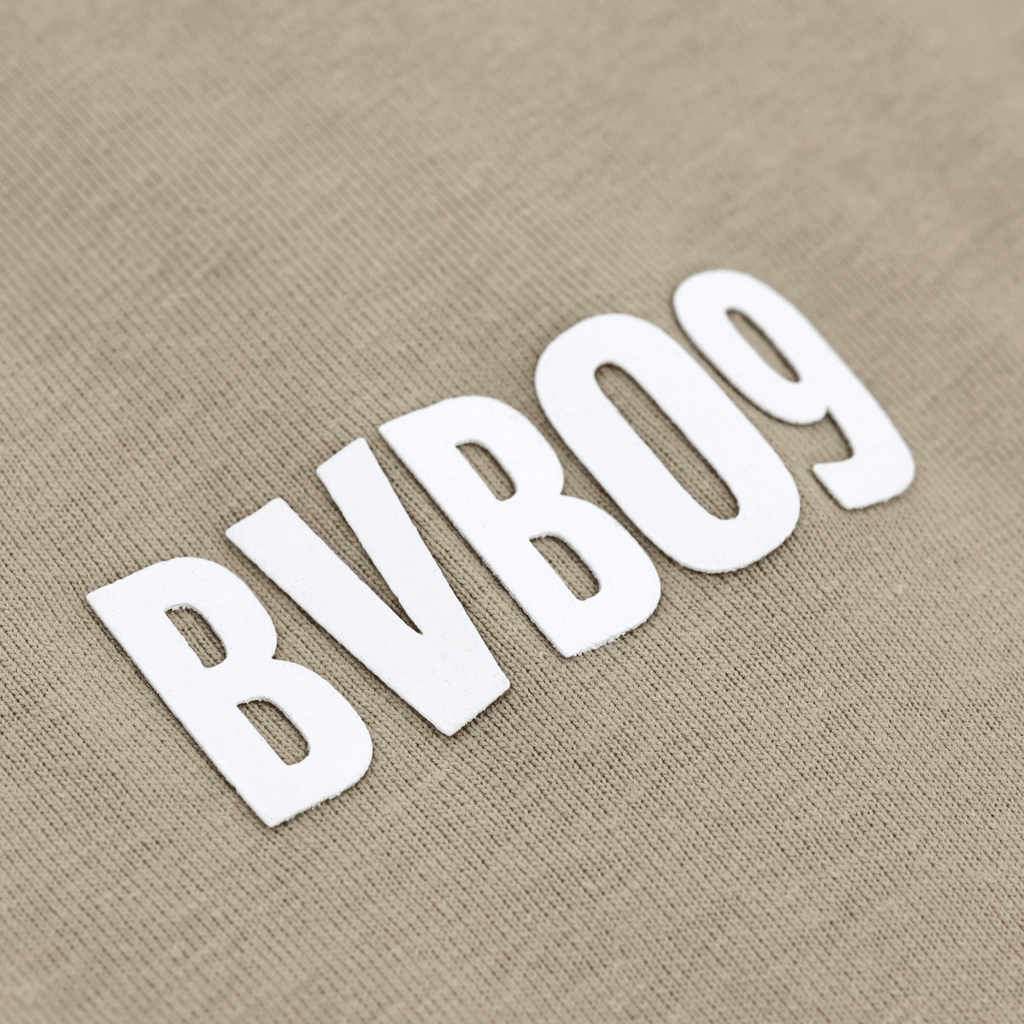 Close-up of a sage-green BVB T-shirt featuring prominent "BVB 09" lettering in white—perfect for BVB fans.