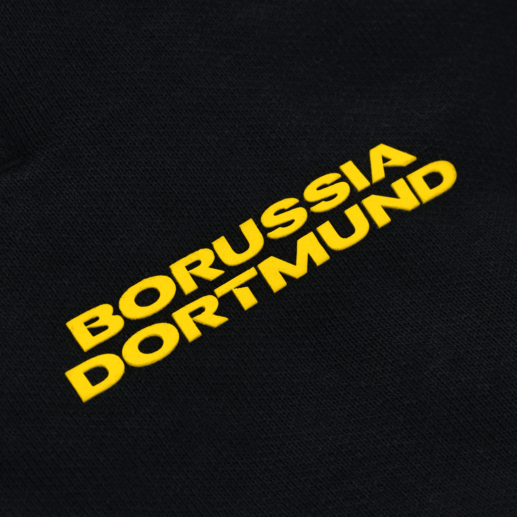 Pantalones de chándal negros para niños con el logotipo amarillo del Borussia Dortmund, ideales para los aficionados del BVB.
