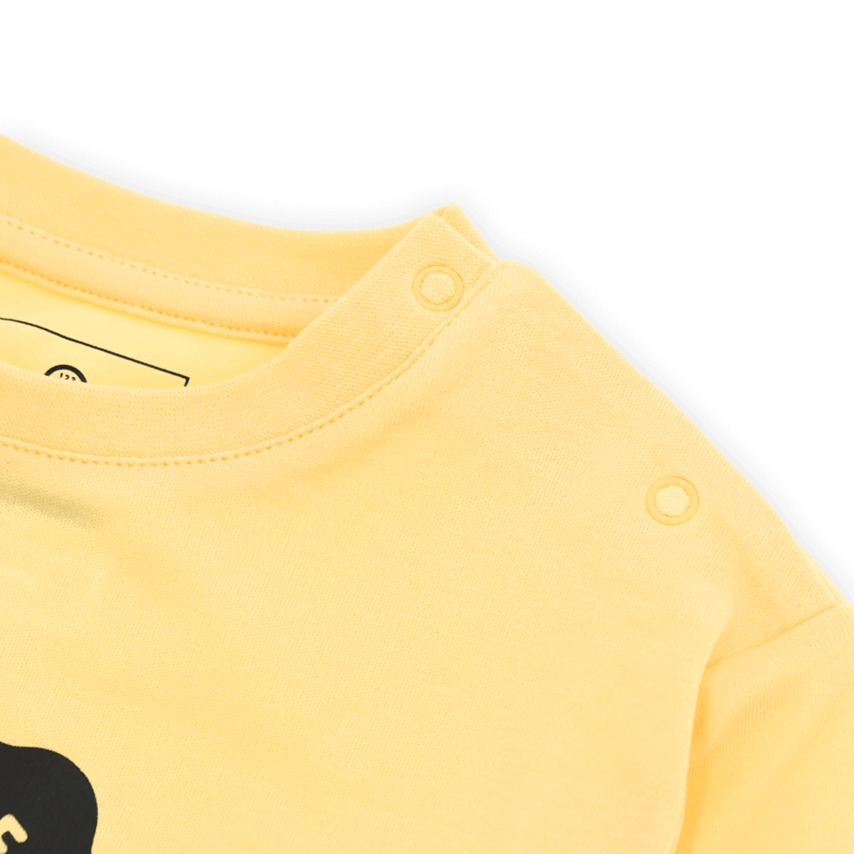 Camiseta amarilla de manga larga para bebé de la colección del BVB y Barrio Sésamo, con botones en el hombro para ponérsela y quitársela fácilmente.