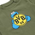 Green jogging set for babies and toddlers featuring the BVB logo and Cookie Monster from Sesame Street as a design highlight.