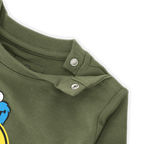 Green BVB tracksuit set for babies and toddlers featuring a Sesame Street Cookie Monster design and convenient snap buttons on the shoulder.