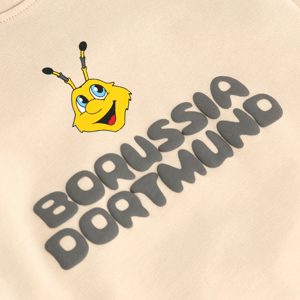 Beige BVB sweater for babies and toddlers featuring the yellow EMMA design and black Borussia Dortmund lettering on the front.