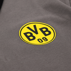 Close-up of a gray polo shirt featuring the yellow BVB logo, sold as fan merchandise.