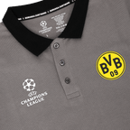 Gray polo shirt from the BVB Champions League 2025 collection with a black collar, yellow BVB emblem, and white "UEFA Champions League" lettering on the chest.