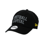 Black BVB New Era 9Twenty College cap for kids with gray "Football Capital" lettering and a yellow New Era logo on the side, perfect for Borussia Dortmund fans.