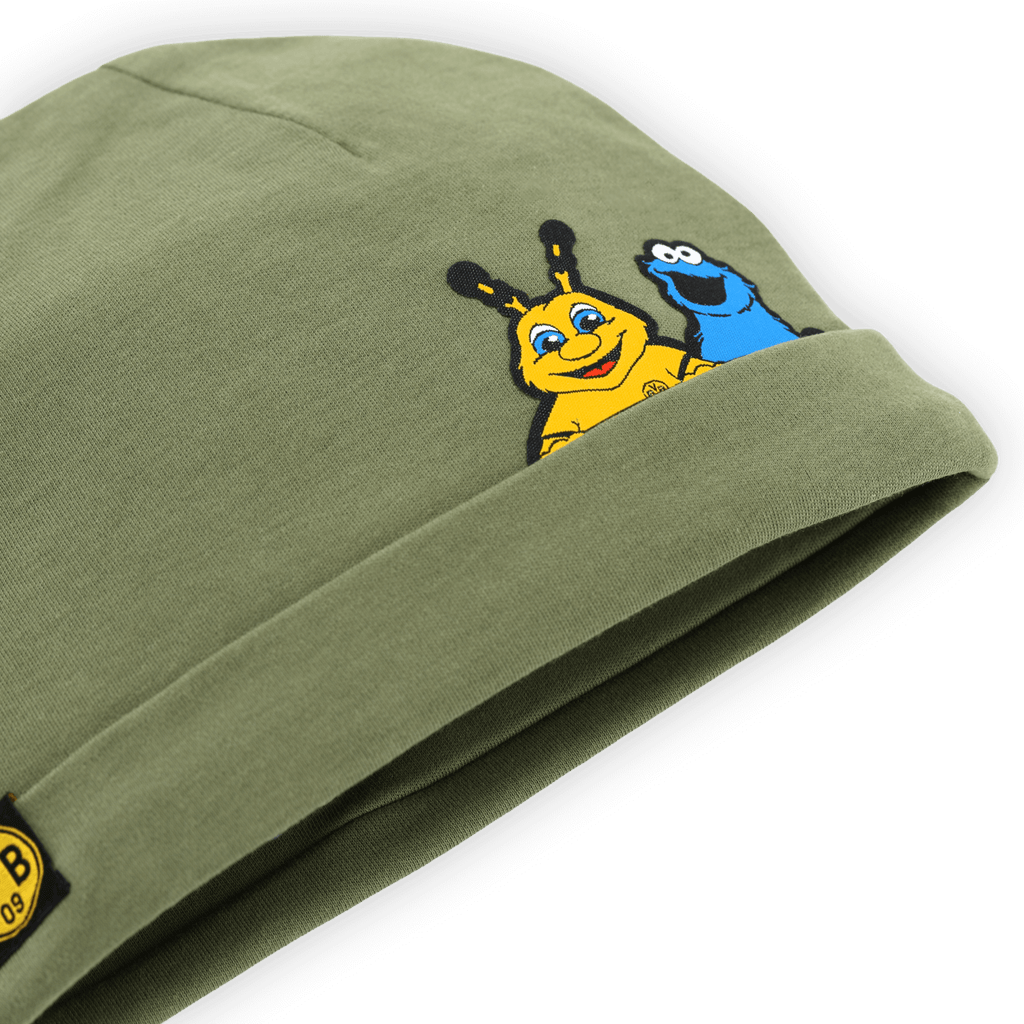 Green baby hat featuring a BVB-Sesame Street design with cute Emmi and Cookie Monster prints and the classic BVB logo.