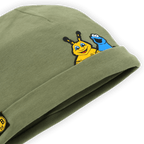 Green baby hat featuring a BVB-Sesame Street design with cute Emmi and Cookie Monster prints and the classic BVB logo.