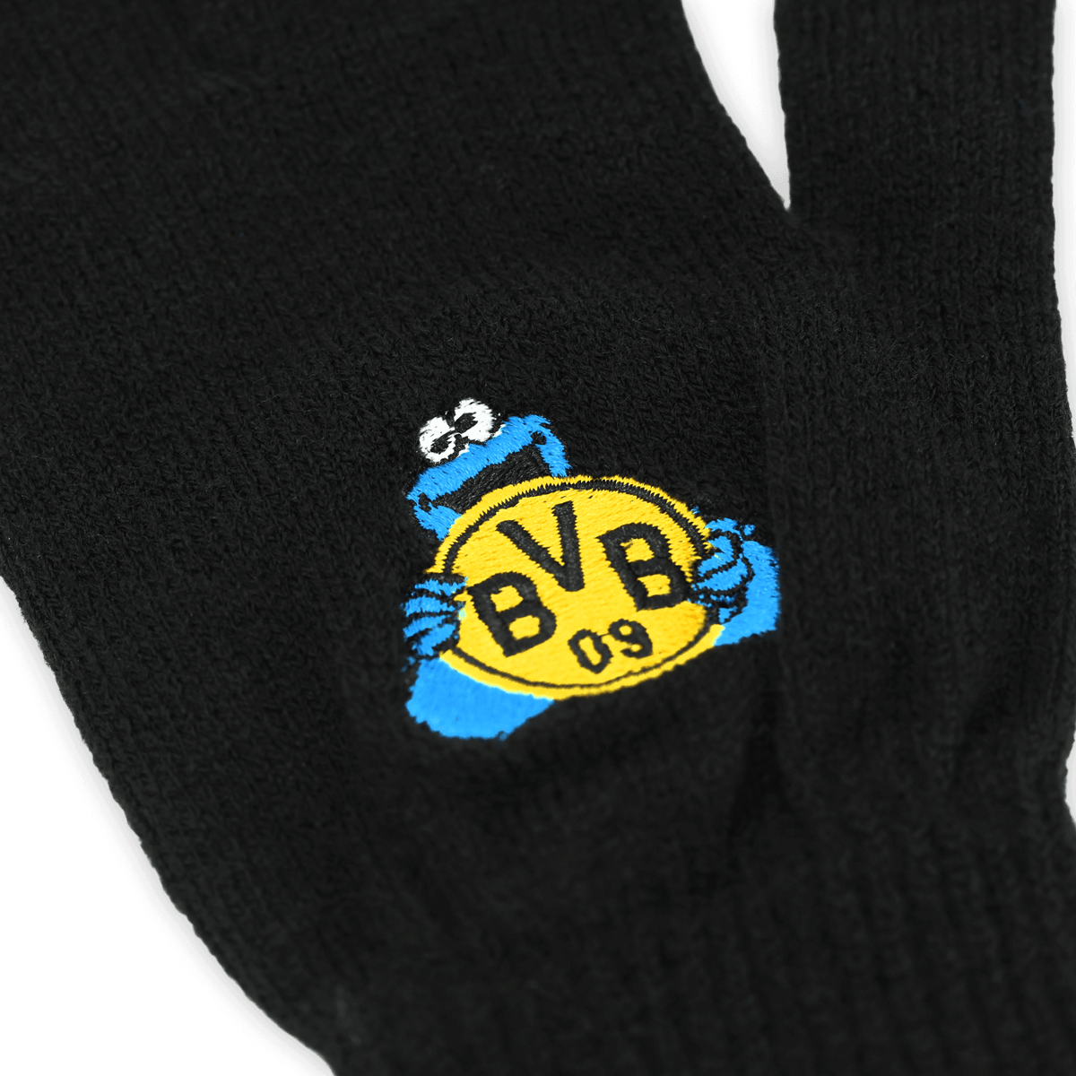 Schwarze Kinderhandschuhe von BVB aus der Sesamstraße-Kollektion mit Krümelmonster und BVB-Logo, ideal für junge Fans des Vereins.