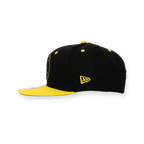 Casquette snapback pour enfants de la collection BVB, motif noir et jaune avec un logo New Era bien visible sur le côté.