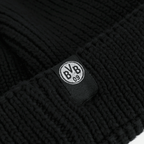 Schwarze BVB Fischerbeanie mit auffälligem BVB-Logo auf einem gewebten Etikett; ein stilvolles Fan-Accessoire für Borussia Dortmund Fans.
