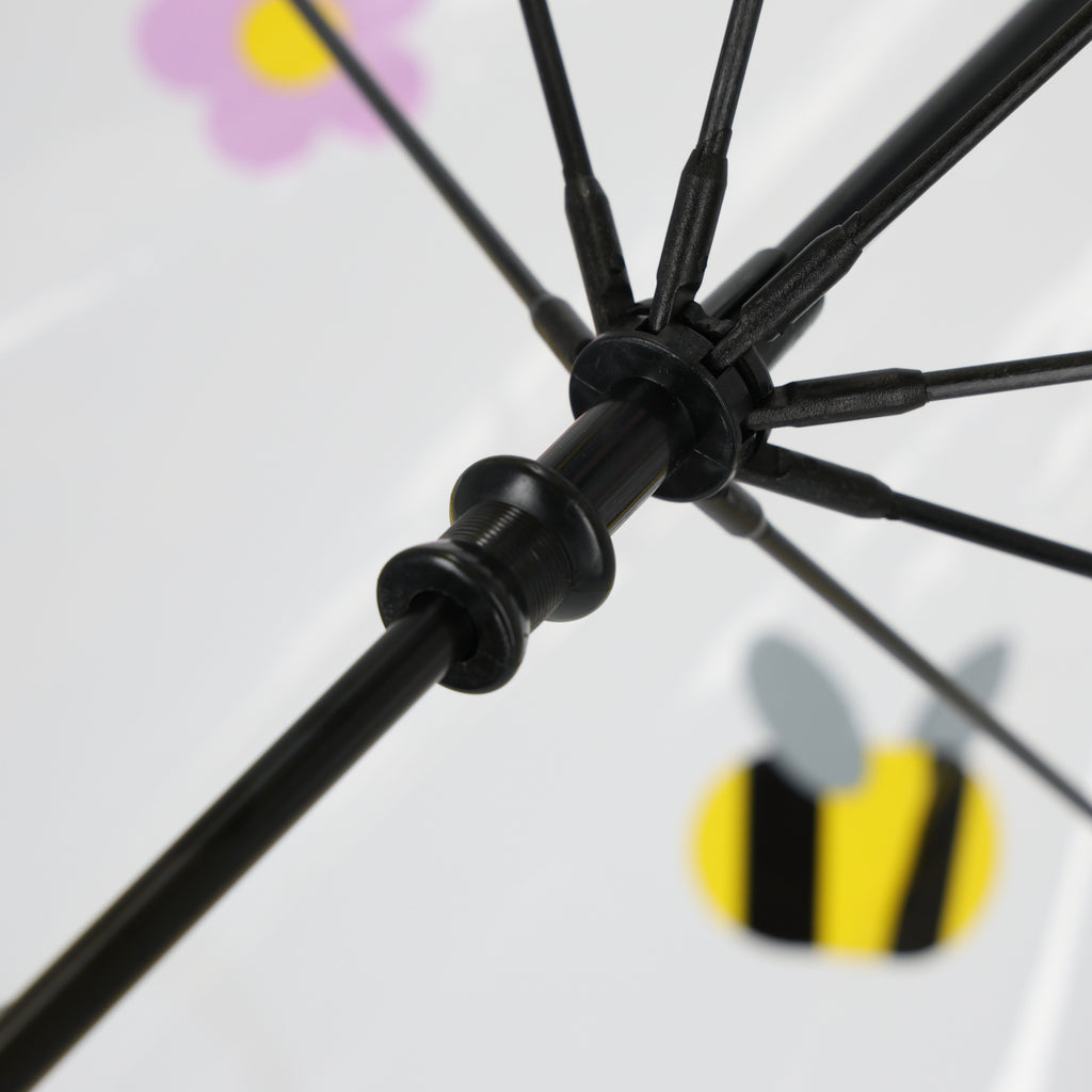 Vue détaillée du parapluie pour enfants du BVB, orné d'une abeille aux couleurs noir et jaune et d'un motif floral, idéal pour les jeunes supporters du Borussia Dortmund.
