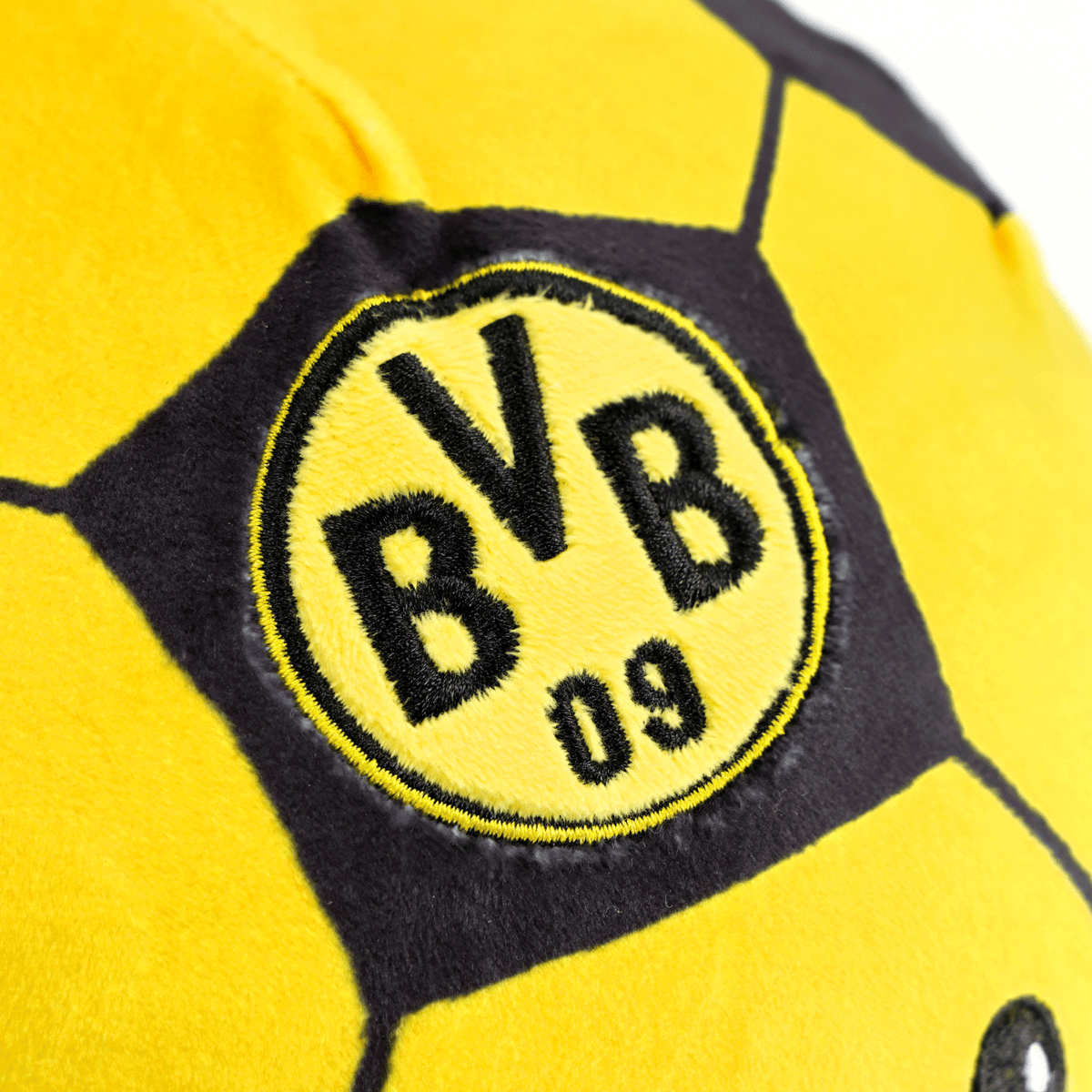 Ein weicher BVB-Squeezy Ball in schwarzgelbem Design mit aufgesticktem BVB 09 Logo, ideales Fan- und Stressspielzeug.