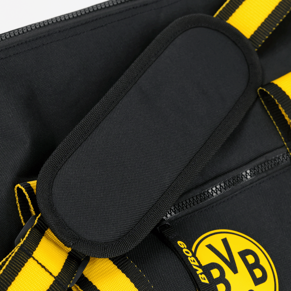 Sac de sport noir et jaune BVB 09 avec des anses et un logo BVB bien visible, idéal pour les supporters et le sport.