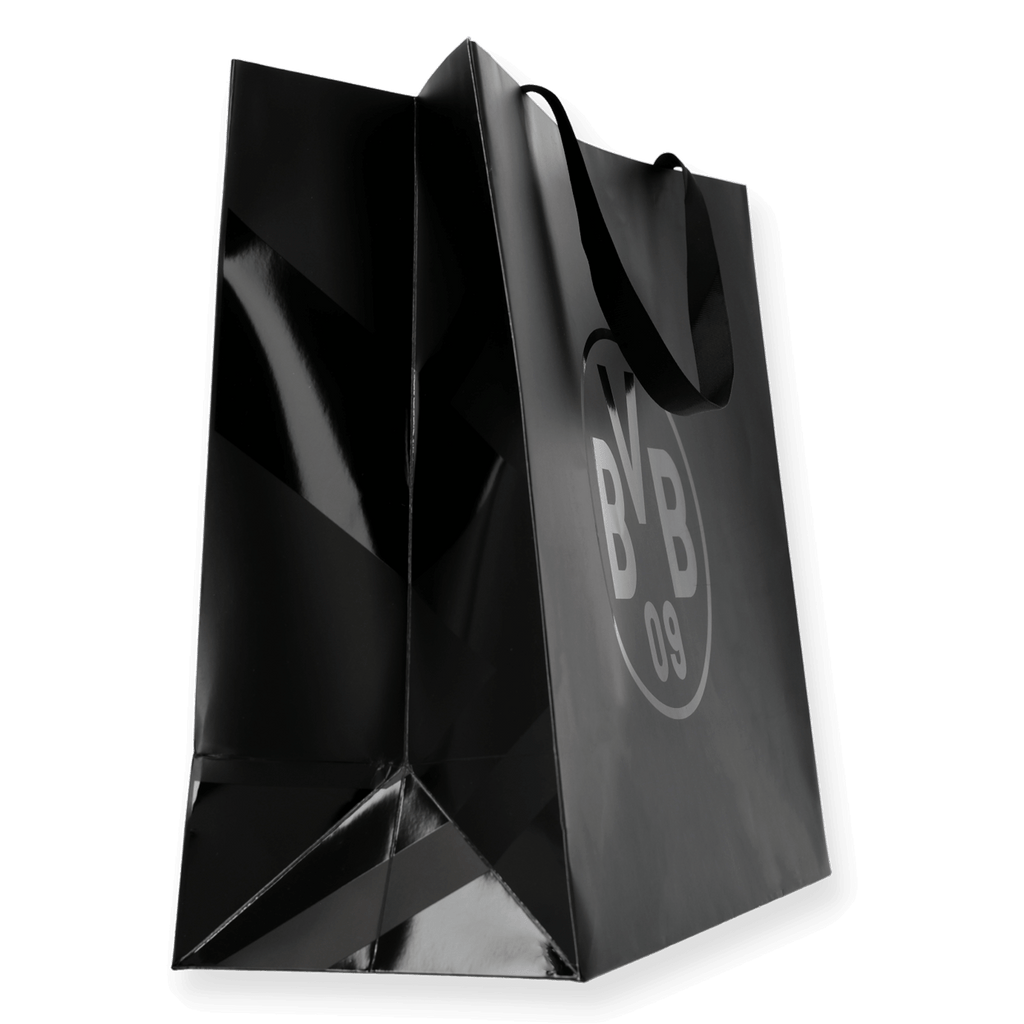 Sac cadeau noir arborant le logo BVB 09, de taille moyenne, idéal pour les supporters du Borussia Dortmund.