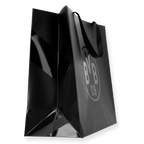 Sac cadeau noir arborant le logo BVB 09, de taille moyenne, idéal pour les supporters du Borussia Dortmund.