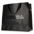 Sac cadeau noir du BVB orné du logo du Borussia Dortmund en lettres claires, idéal comme emballage cadeau élégant pour les supporters.