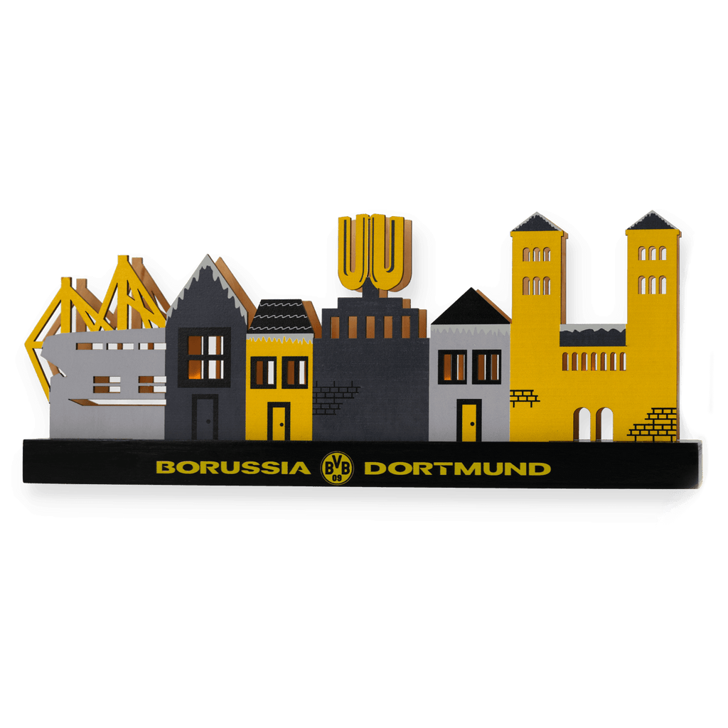 Schwarzgelbe Miniatur des BVB Weihnachtsdorfs mit Gebäuden der Dortmunder Skyline, SIGNAL IDUNA PARK und Borussia Dortmund Logo auf schwarzem Sockel.