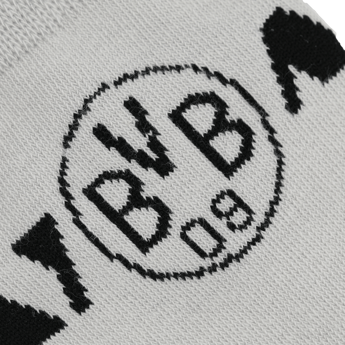 Detailaufnahme von BVB-Socken mit schwarzweißem Design und zentralem BVB-Logo. Perfekt als Fanartikel und Geschenkset.