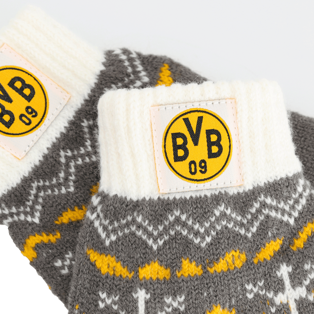 BVB-Kinder-Handschuhe in grau-weißem Strickdesign mit schwarzgelbem BVB-Logo.