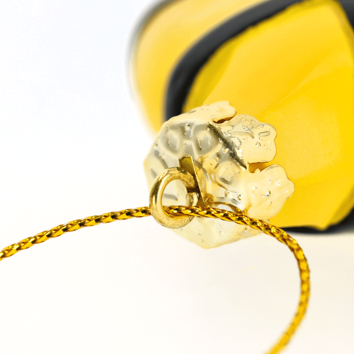 Black-and-yellow BVB tree ornament shaped like a jersey with a gold hanger, ideal for Christmas trees and as a decoration for Borussia Dortmund fans.