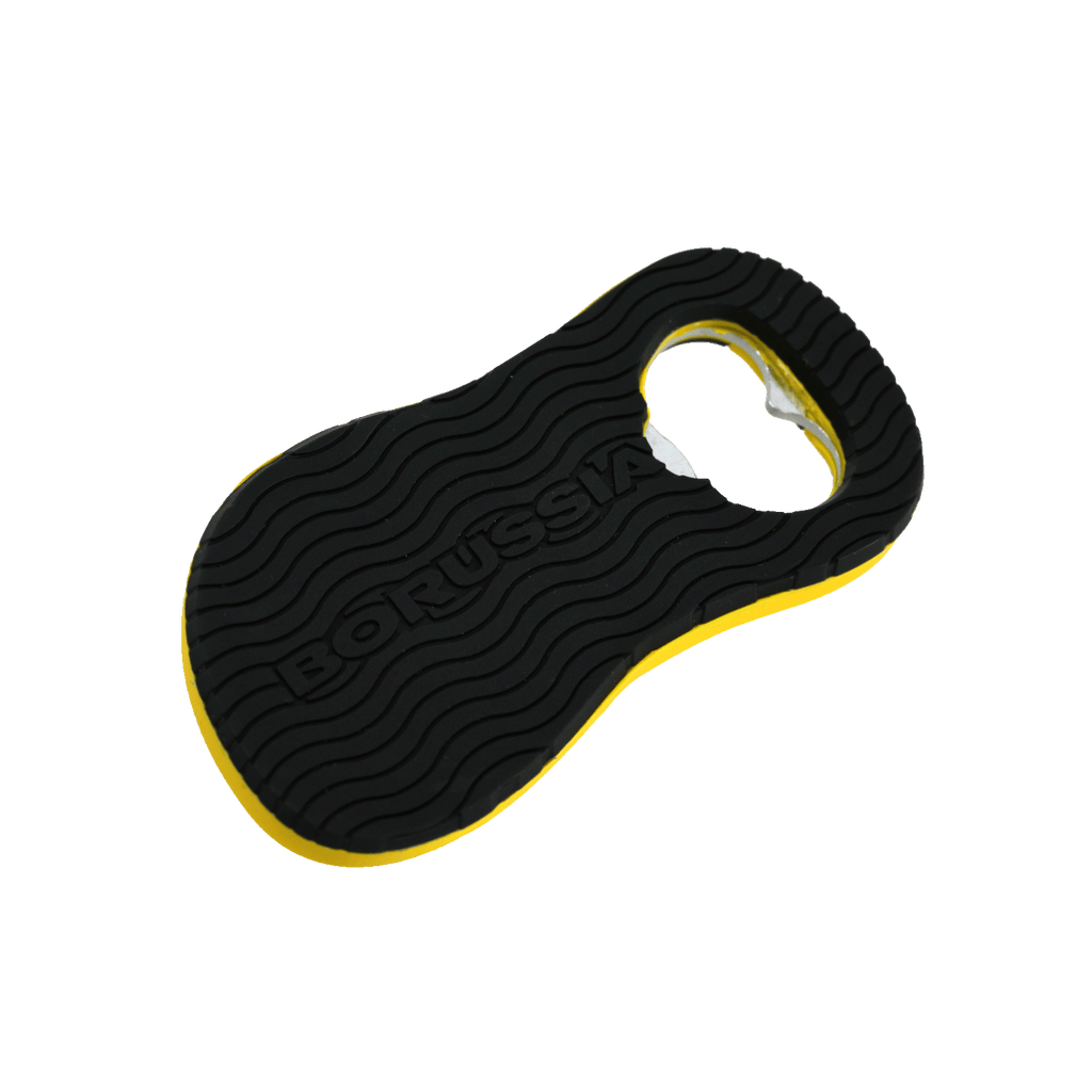 Apribottiglie nero e giallo a forma di sandalo del BVB, con la scritta "Borussia" impressa e un design ondulato.