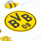 BVB placemat set for kids (set of 2) featuring a prominent black-and-yellow BVB logo, a cartoon bee, and floral motifs on a white background—perfect for young fans.