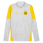 Maglia da allenamento del BVB 2025/26 color grigio argento con elementi gialli, il gatto PUMA e lo stemma BVB-09 sul petto.
