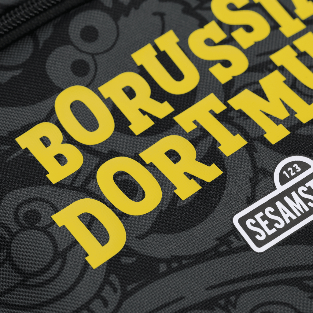 Black-and-yellow BVB backpack with a Sesame Street design, ideal for children or fans, prominently features the Borussia Dortmund logo.