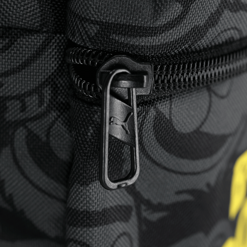 The black-and-yellow BVB backpack in a Sesame Street design with a PUMA zipper—a practical fan accessory for Dortmund fans.