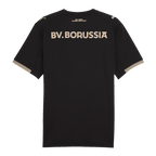 Maillot spécial noir du BVB « 100 ans de Rote Erde », vu de dos, avec des inscriptions dorées et de discrets détails dorés sur les manches.