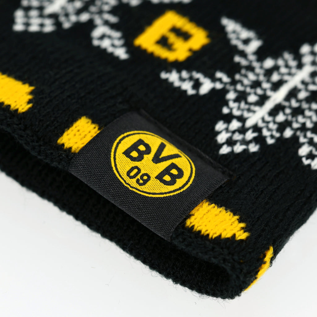 Nahaufnahme eines BVB-Winterstirnbands mit schwarzgelbem Design, BVB 09-Logo und dekorativem Schneeflockenmuster.