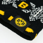 Nahaufnahme eines BVB-Winterstirnbands mit schwarzgelbem Design, BVB 09-Logo und dekorativem Schneeflockenmuster.